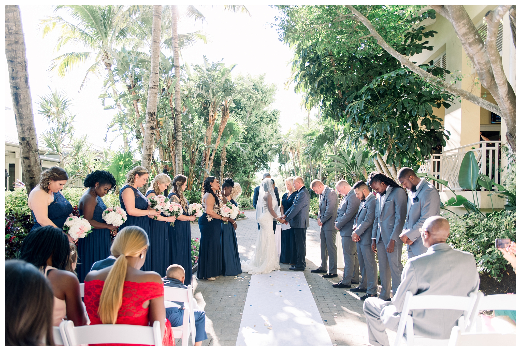 Wedding ceremony in the courtyard at the Hyatt Regency Coconut Point by Jessica McCalla Photography