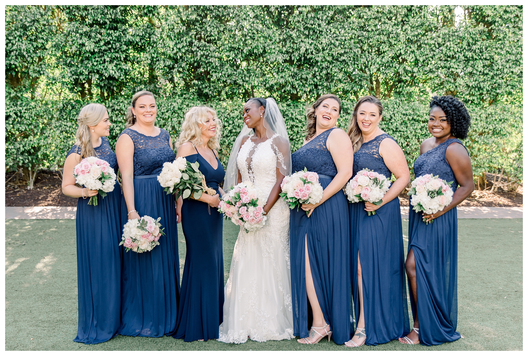 Bride with her bridesmaids, navy and blush accents. Hyatt Regency Coconut Point and Naples, Fl wedding photographer.