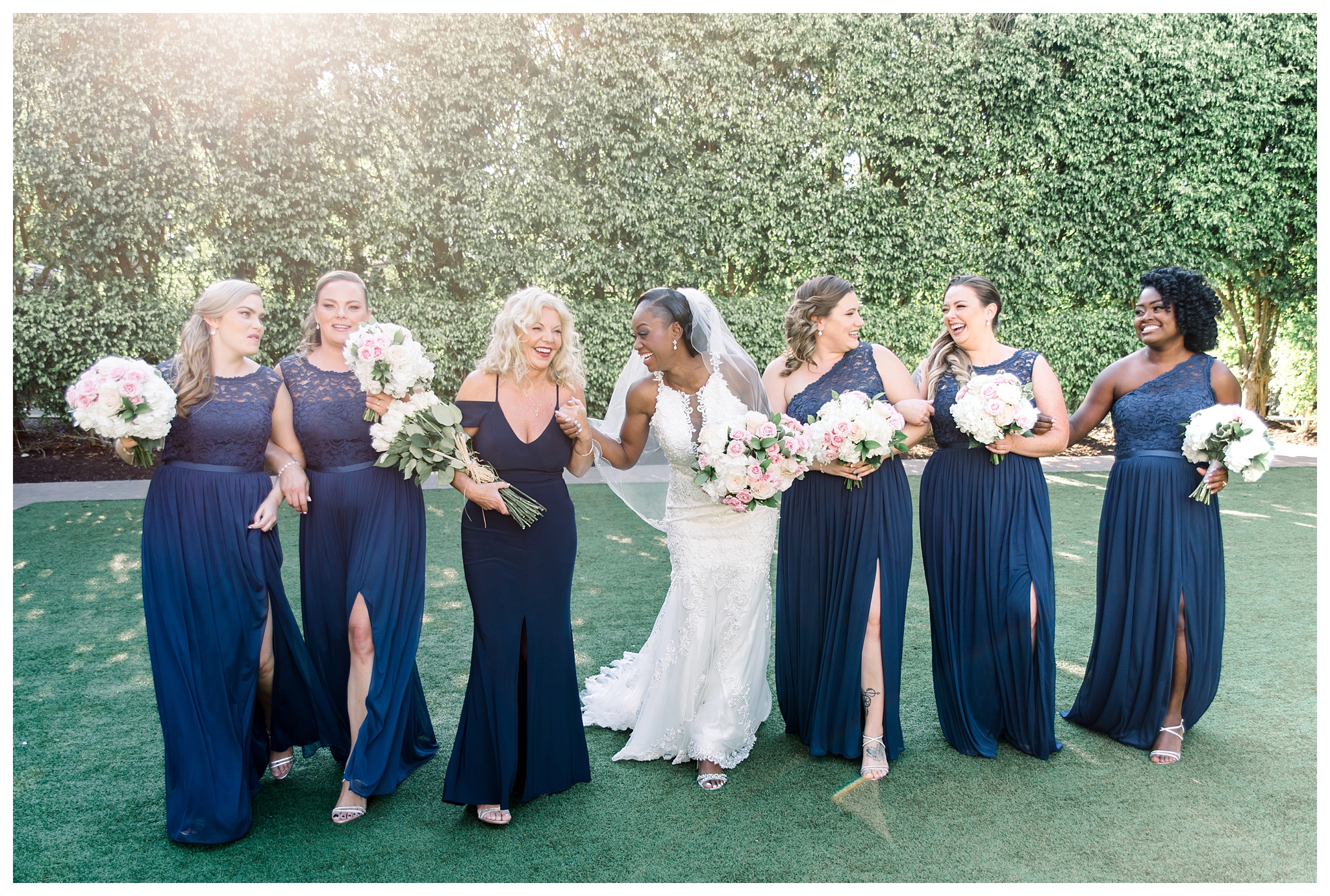 Bride with her bridesmaids, navy and blush accents at the Hyatt Regency Coconut Point by Jessica McCalla Photography